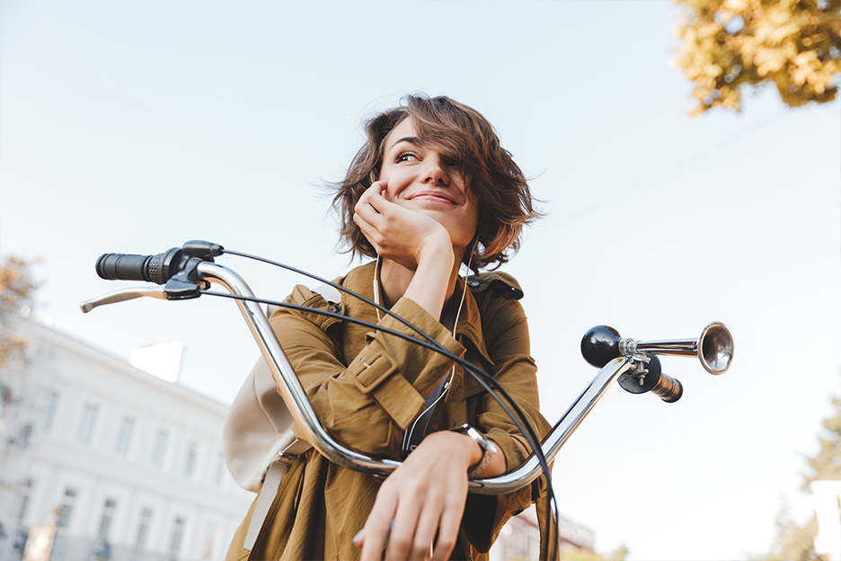 Woman with natural makeup on her bike