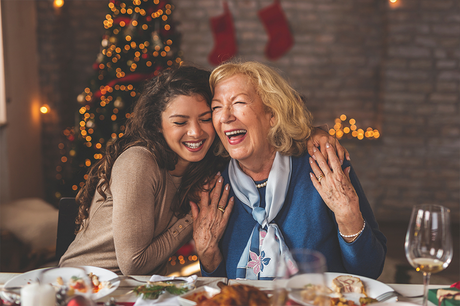 Two women celebrating the holidays over a meal