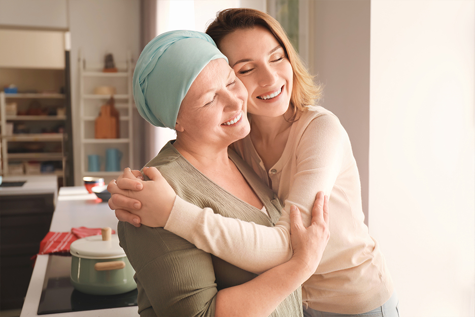 A person lends their support to someone who has been diagnosed with cancer.